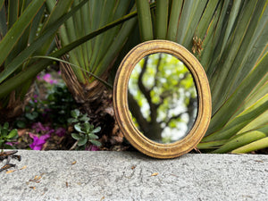Espejo ovalado dorado